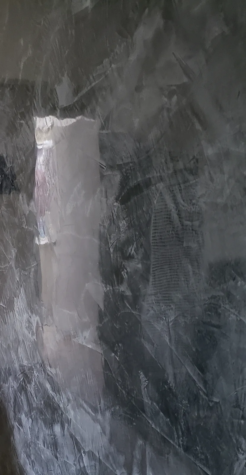 Polished plaster interior wall with a layered decorative finish