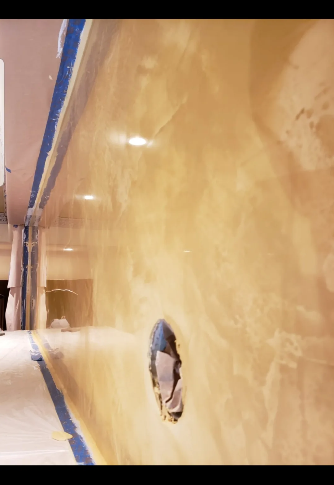 Decorative plaster application with a smooth mottled appearance